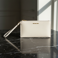 Béžová kožená psací taška Michael Kors